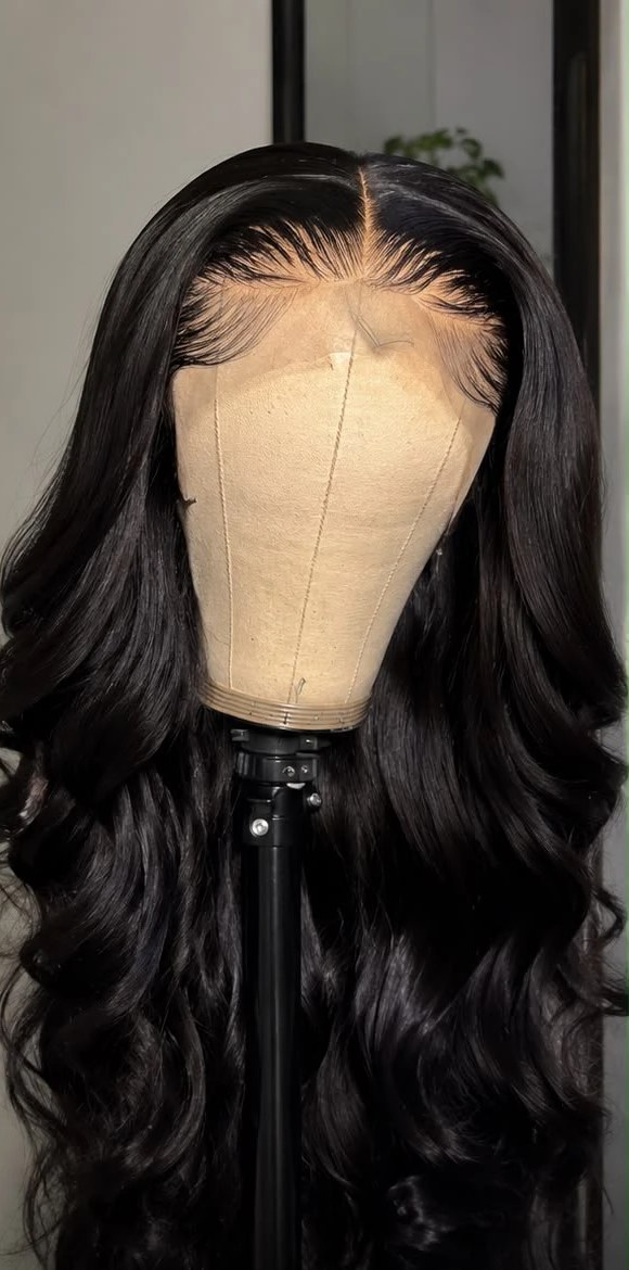 After: the same wig revamped, glossy defined body waves and a clean, plucked lace hairline